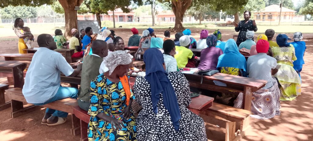 Senior Women Teacher engaging parents on menstrual myths & hygiene during a dialogue meeting